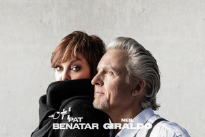 Two people standing close together against a plain background with 'Pat Benatar & Neil Giraldo' text.